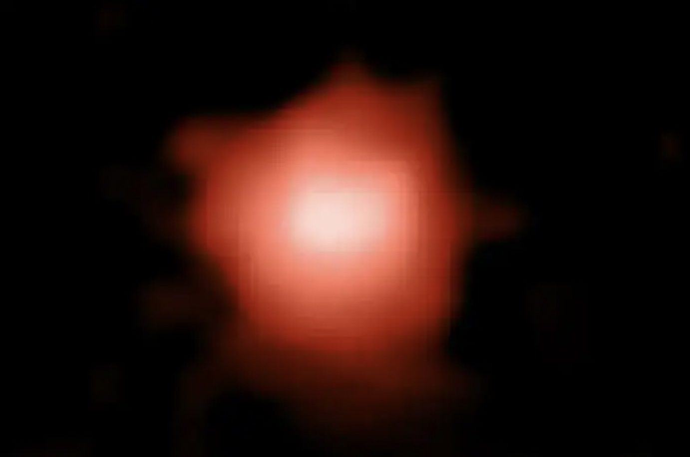 Vesmírny teleskop Jamesa Webba spozoroval galaxiu GLASS-z13 (na fotke), ktorá vznikla 300 miliónov rokov po Veľkom tresku.