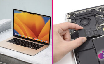 MacBook na stole a SSD v ruke používateľa