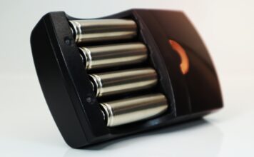 Rechargeable,Alkaline,Batteries,In,A,Battery,Charger,On,A,White