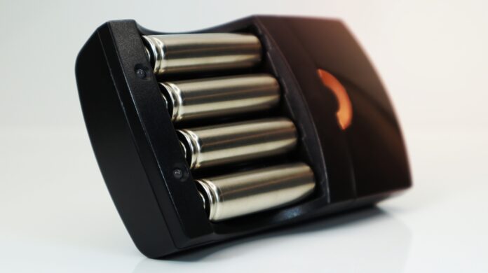 Rechargeable,Alkaline,Batteries,In,A,Battery,Charger,On,A,White Rechargeable,Alkaline,Batteries,In,A,Battery,Charger,On,A,White