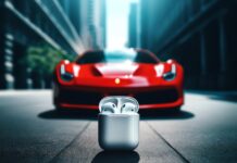 Slúchadlá AirPods na zemi s automobilom Ferrari v pozadí